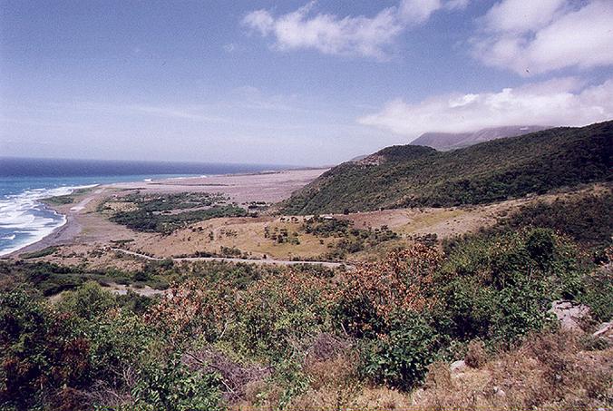 Montserrat's volcano at right, with ash layer