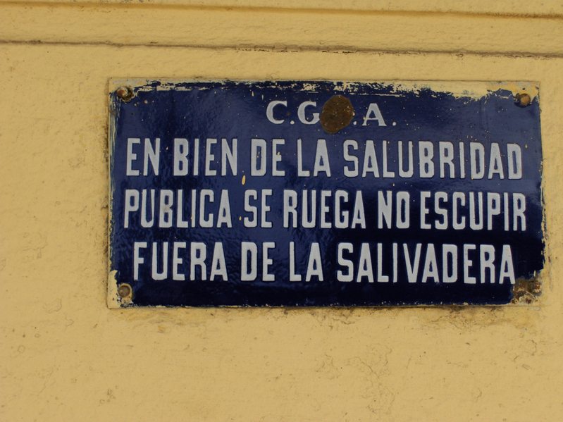 A SIGN AT THE RAILROAD STATION "IN SAKE OF THE PUBLIC HEALTHINESS WE ASK NOT TO SPIT OUT OF THE SPITTOON"