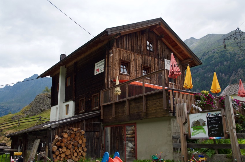 An alpine guesthouse/restaurant at 46.99968°N 11.00428°E. You should park your car here instead of trying to drive up the steep gravel doubletrack.