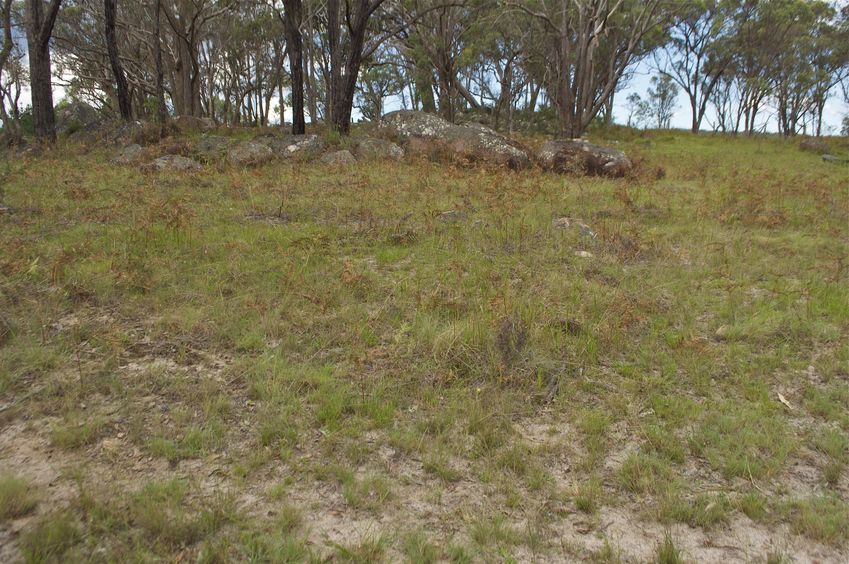 The confluence point lies in rock-strewn farmland