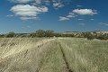 #2: Looking west along the fence. Farmhouse in the distance.