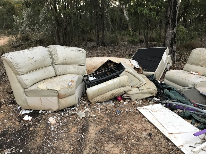 You can have a seat near the confluence point, as the area is filled with illegally dumped trash, but I wouldn't advise sitting here.