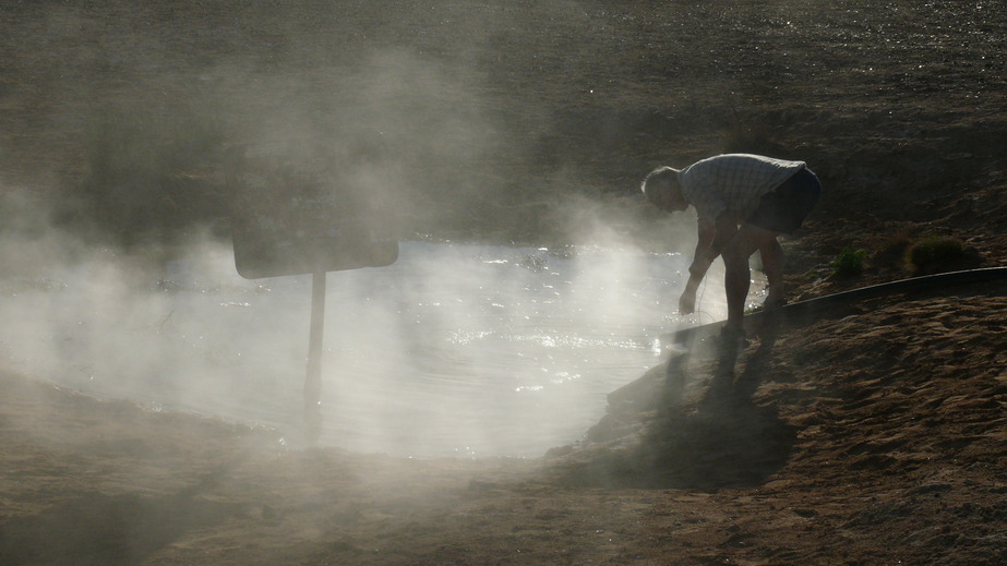 Artesian Bore with hot water running into ground tank