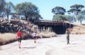 #4: Sarah, Peter and Maddy walking along the river bed to the bridge