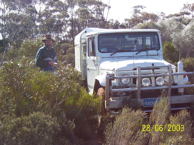 Vehicle on overgrown Track