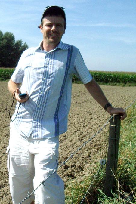 Peter at the fence post that has all the Zeros