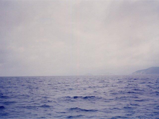 West View  - towards Rio de Janeiro..you see 3 hills (from left to right): a small island, Rio de Janeiro skyline, the mainland coast close to Itaipu bay