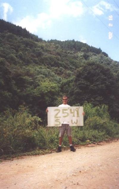 Me at the confluence with the banner