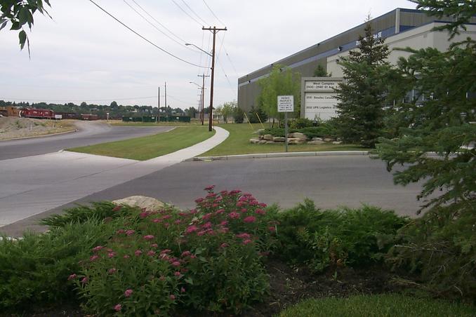 A view looking west showing 61st Street, the rail yards and the south side of the building.