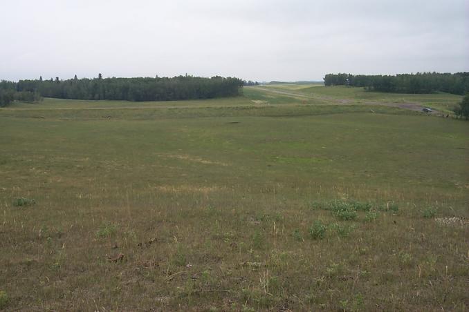 Overview looking south from the hill seen in picture #2.  The confluence point is in the center of the picture.