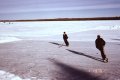 #3: A father and son practice hockey on the lake.