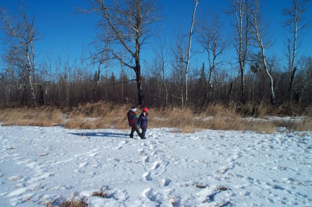 Looking east my son holding the GPS receiver and my daughter waiting to go back to the car