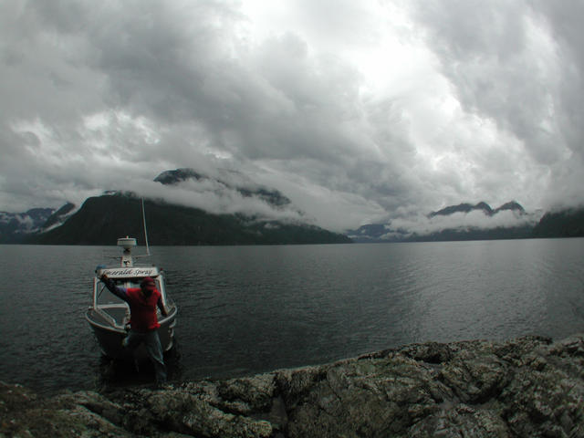 mark and his boat, mooring at the confluence area.