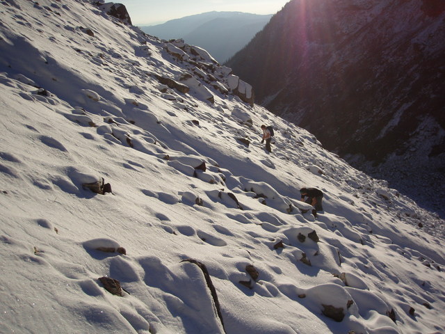 Ivan and Scott climbing up the snow covered scree slope leading to 52N 119W.