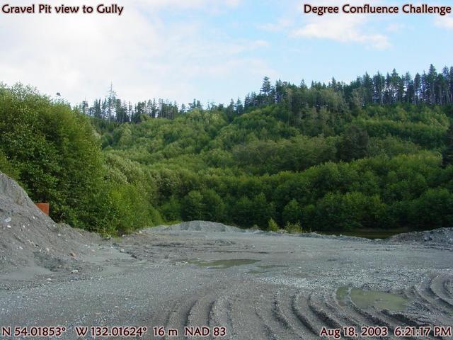 Cross gravel pit towards gully at back end.