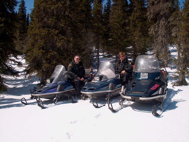 Officers Poole and Bradley on snowmobiles, close to confluence 53N57W.