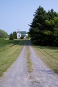 #8: Looking south along Lodge Lane, about 175 metres north of the confluence point, which lies in a field behind the large tree