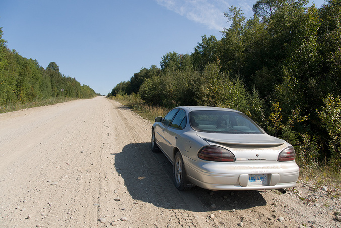 Our rental car parked on service road near 49 N 83 W