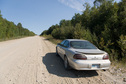 #7: Our rental car parked on service road near 49 N 83 W