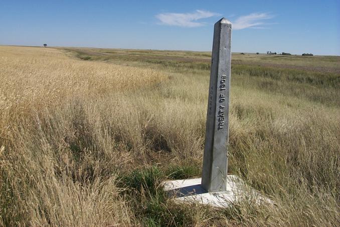 The view southeast of the cement border monument about 800 m west of the confluence.