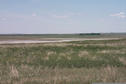 #2: Looking east.  Dried up small lake bed showing white saline residue can be seen.