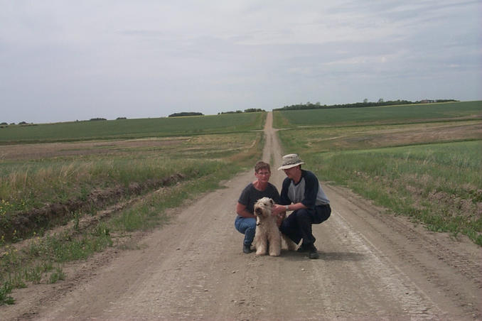 Carolyn, Max and Alan withthe grid road trailing off to the west behind them.