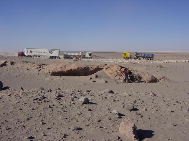 I parked my bike behind a big rock next to the ALMA project road