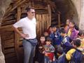 #4: Tony (sporting his new "square" haircut) and children at the boarded up entrance to the coal mine, 380 metres northwest of the confluence