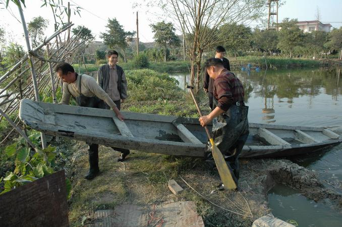 Moving the boat into the Confluence Pond for the dance on water