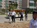 #5: The driver stopped the electric vehicle at the confluence point, and we all piled out for some more photo opportunities. Here Mr Huang, Vice President and Deputy Managing Director (in the blue shirt), is speaking with Emily.