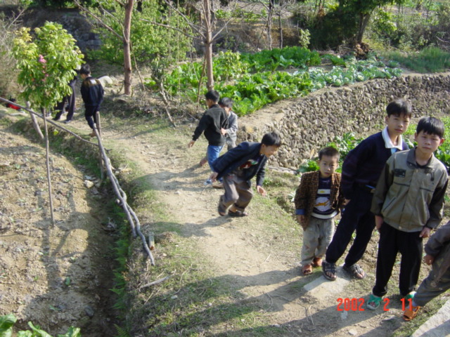 Children scrambling to avoid the camera