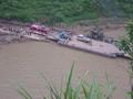 #3: My bus driving off the vehicular ferry after crossing the Buliu River at Banai