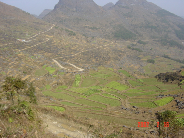 Another possible approach is the track disappearing over the top of the hill at the top left of this photo