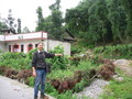 #3: The white tiled house where we got off the bus, with Targ indicating the direction of the confluence, 450 metres to the east.