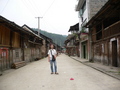 #2: Targ in the main street of Shuāngjiāng, which consisted predominantly of old wooden buildings, with a few new brick and tile structures sprouting up amongst them.