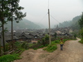 #5: Ah Feng arriving in Kēngdòng, with the confluence 2.17 kilometres east.