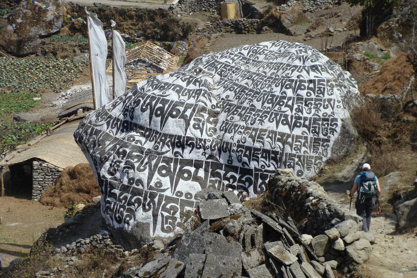 According to Buddhist doctrine, large Mani walls, such as this one, should be passed from the left side, the clockwise direction in which the earth and the universe revolve.