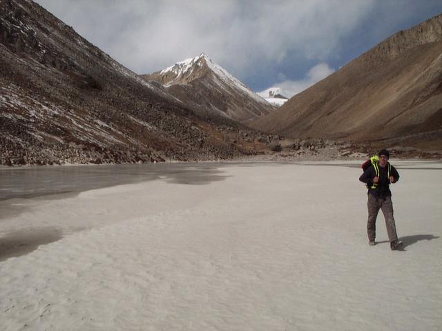 Rainer walking across giant sand flat in U-valley