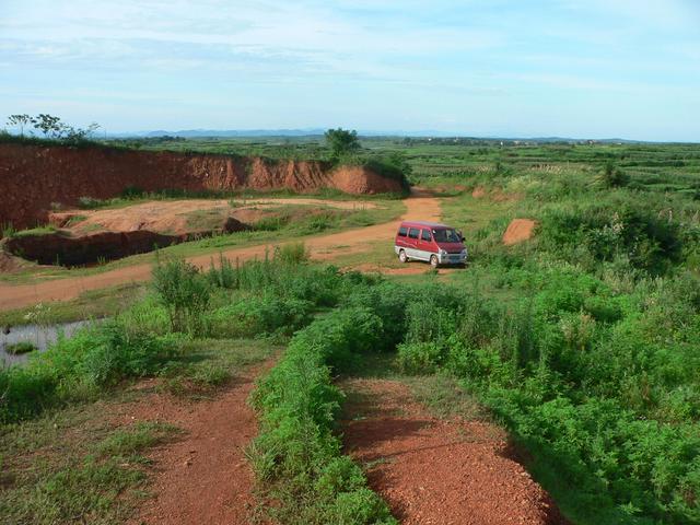 Our minivan taxi in its lonely parking spot 590 metres east of the confluence.