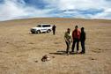 #6: Leslie, Mike, and Buchong the guide at the confluence, with Mr Wei the driver approaching after he decided he could follow in the vehicle.  Note the pre-existing cairn.