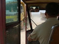 #5: Our three-wheeler dodging trucks loaded with rocks and gravel