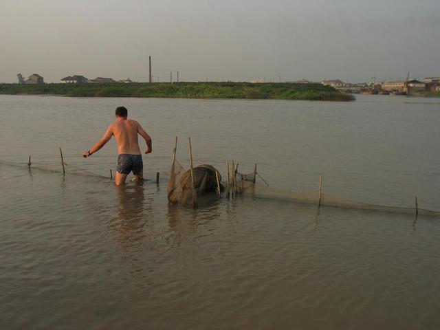 Corrado prepares for the return swim to the levee