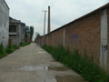 #3: Looking north (from 38 m west of the confluence), the smokestack clearly visible