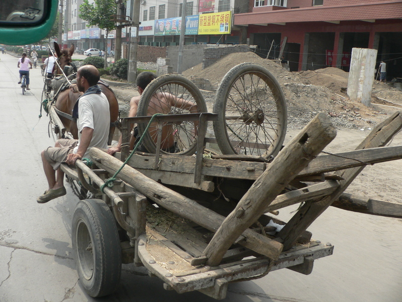 A horse-drawn cart, with a spare in the back