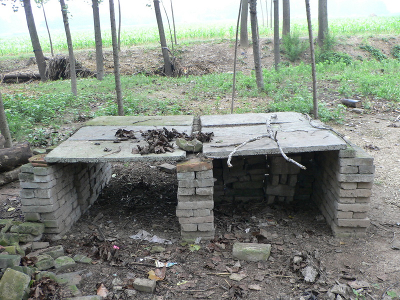 The confluence table: cement slabs supported by stacks of bricks