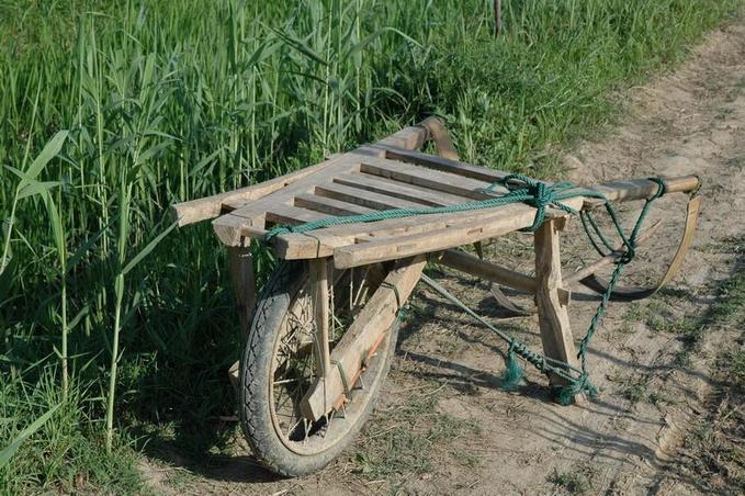 A single wheel push cart near the CP