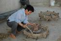 #9: Cleaning the tractor wheels in nearby farm house