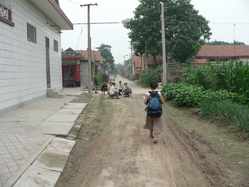 Ah Feng walking through the residential area