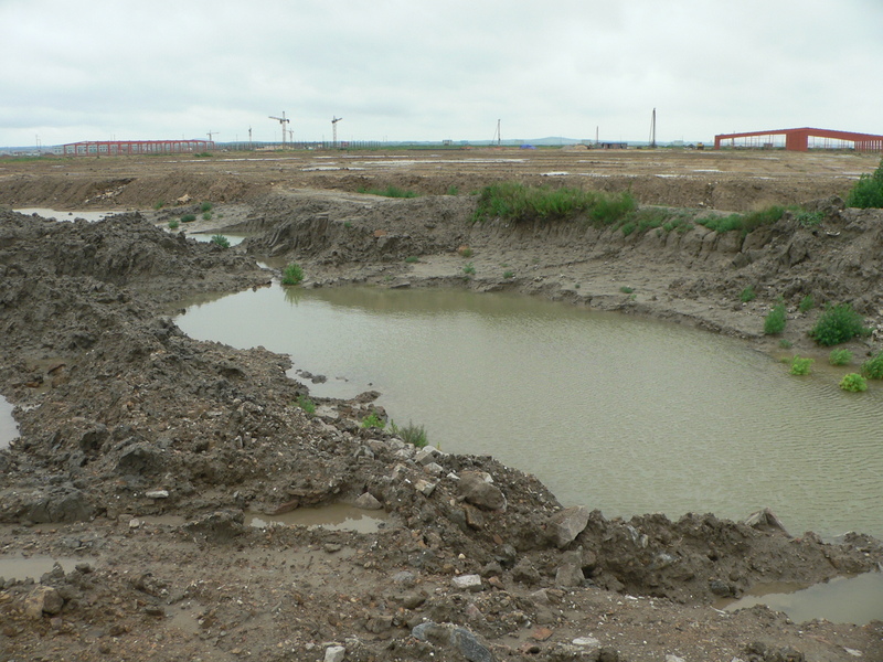 Looking east, with evidence of development work in the distance