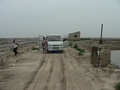 #3: Ah Feng and our driver by the minivan, 325 m north of the confluence